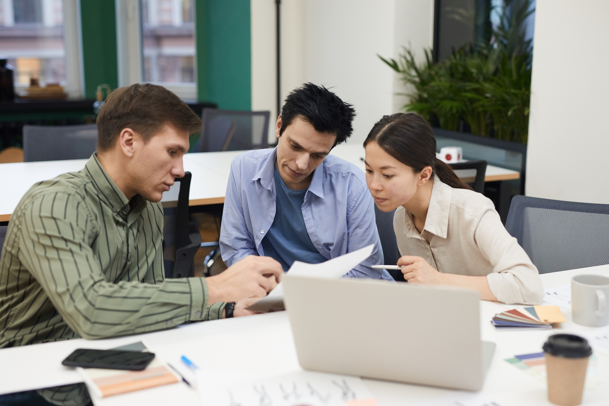 Business people examining the contract
